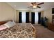 Comfortable bedroom with carpet, ceiling fan and double windows at 2040 Port Royal Dr, Laughlin, NV 89029