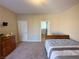 Comfortable bedroom with a dresser and plush carpet flooring at 2040 Port Royal Dr, Laughlin, NV 89029
