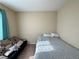Cozy bedroom with neutral tones, space-saving futon, and bright natural light at 2040 Port Royal Dr, Laughlin, NV 89029