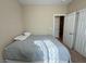 Comfortable bedroom featuring closet with sliding doors and light-colored walls and carpet at 2040 Port Royal Dr, Laughlin, NV 89029