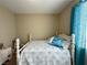 Bedroom featuring carpet, a window with curtains, and a white bed, creating a relaxing and inviting space at 2040 Port Royal Dr, Laughlin, NV 89029