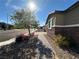 Exterior view of a home with desert landscaping and brick pavers on a sunny day at 2040 Port Royal Dr, Laughlin, NV 89029