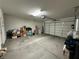 Spacious garage with white door, high ceilings, storage, and overhead lighting at 2040 Port Royal Dr, Laughlin, NV 89029