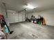 Garage featuring a white door, overhead storage, and high ceilings at 2040 Port Royal Dr, Laughlin, NV 89029