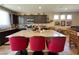Open kitchen with granite counters, island with seating, and dark cabinetry at 2040 Port Royal Dr, Laughlin, NV 89029