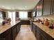 Kitchen with granite countertops, tile flooring, and dark wood cabinets at 2040 Port Royal Dr, Laughlin, NV 89029