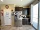 Bright kitchen with stainless steel refrigerator and tile flooring at 2040 Port Royal Dr, Laughlin, NV 89029