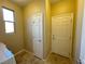 Spacious laundry area near doors with window and clean tile floor at 2040 Port Royal Dr, Laughlin, NV 89029
