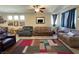 Comfortable living room with a ceiling fan and stylish area rug at 2040 Port Royal Dr, Laughlin, NV 89029