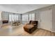 Bright living room featuring wood floors, large windows, and comfortable seating with lots of natural light at 2240 Grayson Cir, Henderson, NV 89014