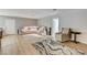 Large living room with a comfortable sectional sofa, neutral walls, and light wood flooring at 2240 Grayson Cir, Henderson, NV 89014