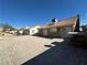 Spacious backyard with desert landscaping, offering a clean and low-maintenance outdoor space at 2266 Carved Canyon Ln, Laughlin, NV 89029