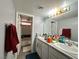 Well-lit bathroom with double sinks, granite counters, and a shower-tub combination at 2266 Carved Canyon Ln, Laughlin, NV 89029