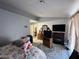 Bedroom with floral bedding and ample space; includes closet access and entertainment center at 2266 Carved Canyon Ln, Laughlin, NV 89029