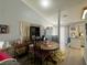 Open dining area with hardwood floors next to the kitchen and living room at 2266 Carved Canyon Ln, Laughlin, NV 89029