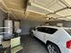 Well-organized garage with a car, water heater, and ample storage space at 2266 Carved Canyon Ln, Laughlin, NV 89029
