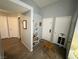 Hallway featuring neutral walls, several doors and vinyl floors at 2266 Carved Canyon Ln, Laughlin, NV 89029
