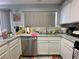 Well-lit kitchen featuring stainless steel appliances and gray countertops at 2266 Carved Canyon Ln, Laughlin, NV 89029