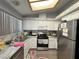 Well-lit kitchen featuring stainless steel appliances and gray countertops at 2266 Carved Canyon Ln, Laughlin, NV 89029
