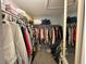 Walk-in closet featuring many clothing items at 2266 Carved Canyon Ln, Laughlin, NV 89029