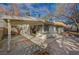 Home exterior showcasing a covered patio, pass-through window, and hardscaped backyard at 2367 E Hacienda Ave, Las Vegas, NV 89119