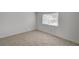 Bright bedroom with tile flooring, a window offering natural light, and neutral walls at 2367 E Hacienda Ave, Las Vegas, NV 89119