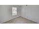 Cozy bedroom with tiled floor and window, bathed in natural light, perfect for relaxation at 2367 E Hacienda Ave, Las Vegas, NV 89119