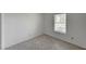 This bedroom features tile floors and a sunlit window, creating a simple and bright space at 2367 E Hacienda Ave, Las Vegas, NV 89119