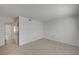 Neutral walls, tiled floor, and doorway to the other rooms are the features of this bedroom at 2367 E Hacienda Ave, Las Vegas, NV 89119