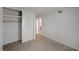 Bright bedroom with neutral walls, tile flooring, and closet with sliding doors at 2367 E Hacienda Ave, Las Vegas, NV 89119