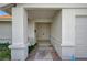 Covered front porch with swing, leading to a double door entry and attached two-car garage at 2367 E Hacienda Ave, Las Vegas, NV 89119