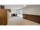 Functional kitchen featuring neutral tile floors, dark cabinetry and sliding door access at 2367 E Hacienda Ave, Las Vegas, NV 89119