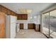 Bright kitchen with white appliances, ample cabinet space, and sliding glass doors to the patio at 2367 E Hacienda Ave, Las Vegas, NV 89119