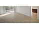 Spacious living room filled with natural light from sliding glass doors and tiled floors at 2367 E Hacienda Ave, Las Vegas, NV 89119