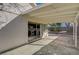 Covered patio with smooth concrete, offering an indoor-outdoor transition to the adjacent kitchen at 2367 E Hacienda Ave, Las Vegas, NV 89119