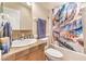 Cozy bathroom featuring a shower and tub combination with a vibrant, colorful shower curtain at 3100 S Fallwood St, Pahrump, NV 89048