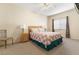 Cozy bedroom with neutral carpet, ceiling fan, and a window with coverings at 313 Haley Way # D, Mesquite, NV 89027