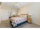 The bedroom includes a ceiling fan, neutral carpet, and a mirrored closet at 313 Haley Way # D, Mesquite, NV 89027