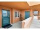 Cozy entrance to the home with teal door, tiled flooring, and a 'home' welcome mat at 313 Haley Way # D, Mesquite, NV 89027