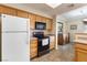 Well-equipped kitchen featuring modern appliances and ample cabinet storage space at 313 Haley Way # D, Mesquite, NV 89027