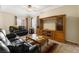 Comfortable living room featuring tile flooring and a large entertainment center at 313 Haley Way # D, Mesquite, NV 89027