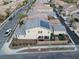 Aerial view of a home with solar panels, backyard patio, and well-kept landscaping at 3237 Mist Effect Ave, Henderson, NV 89044