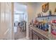 Stylish bar area featuring granite countertops, dark wood cabinets, and a curated selection of spirits at 3237 Mist Effect Ave, Henderson, NV 89044