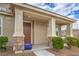 Inviting covered porch with stately columns and stone accents, perfect for relaxing outdoors at 3237 Mist Effect Ave, Henderson, NV 89044