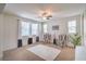 Cozy living room with plush carpet, neutral walls, and stylish striped armchairs at 3237 Mist Effect Ave, Henderson, NV 89044