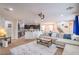 Bright, open-concept living area with plush seating, connecting to the kitchen and dining areas at 3237 Mist Effect Ave, Henderson, NV 89044