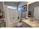 Bathroom with a shower, white vanity, framed mirror, and a window providing natural light at 3341 S Big Sky Way, Pahrump, NV 89048