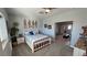 Inviting bedroom with a bed, artwork, and an open layout leading to other areas of the home at 3341 S Big Sky Way, Pahrump, NV 89048
