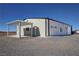 Metal clad building with attached carport in desert landscape at 3341 S Big Sky Way, Pahrump, NV 89048