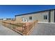 Home exterior featuring a fenced in area with turf and gravel at 3341 S Big Sky Way, Pahrump, NV 89048